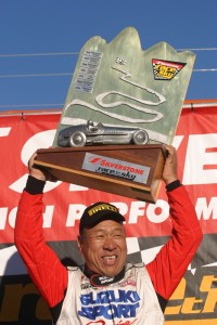 Monster Tajima holding the Race to the Sky trophy in 2005