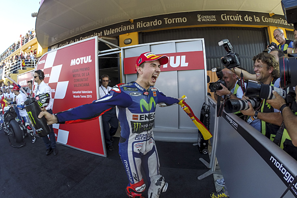 Lorenzo wins Valencia race and MotoGP title as Rossi charges from last to 4th